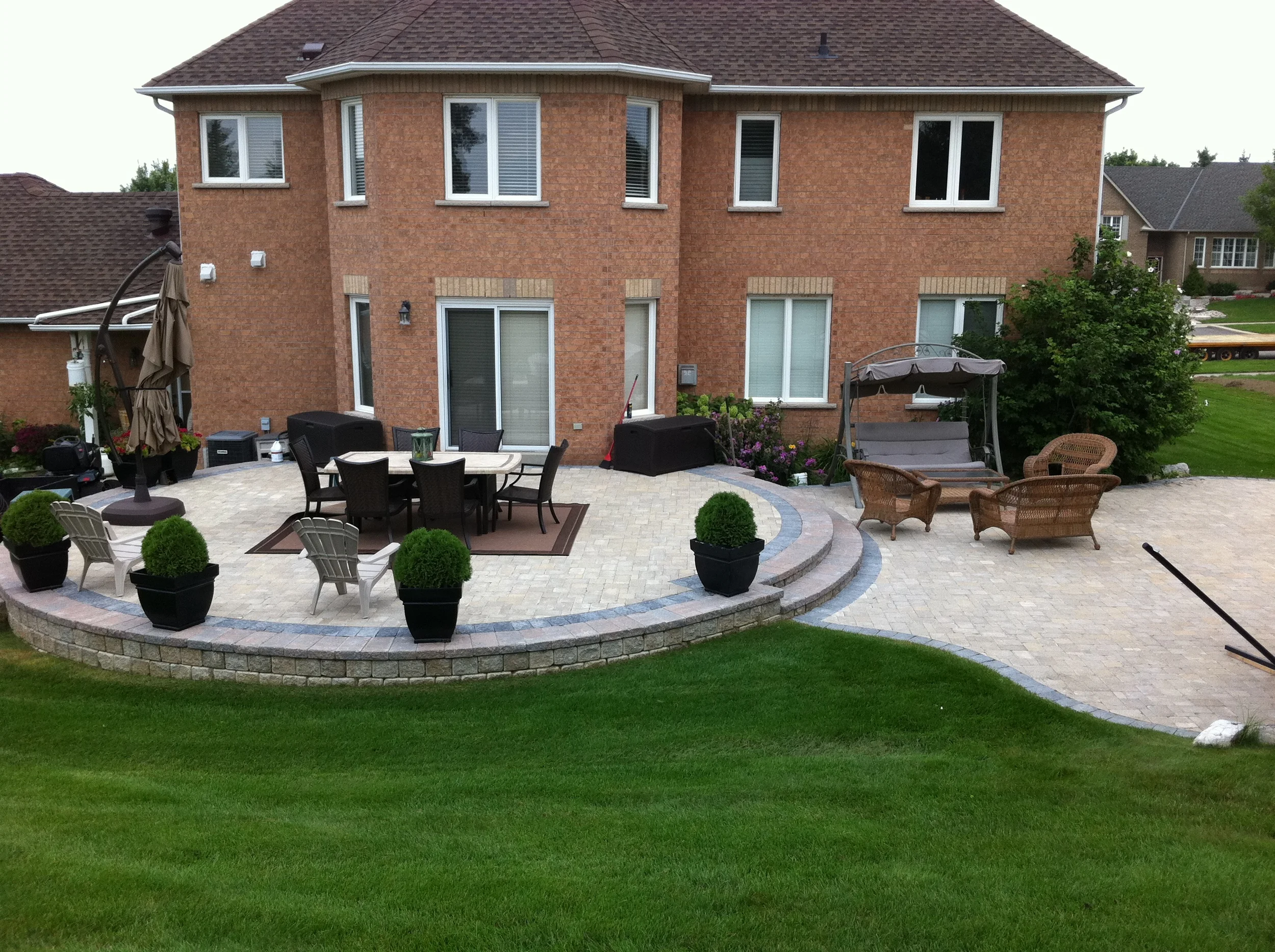 A raised patio and expansive outdoor space.