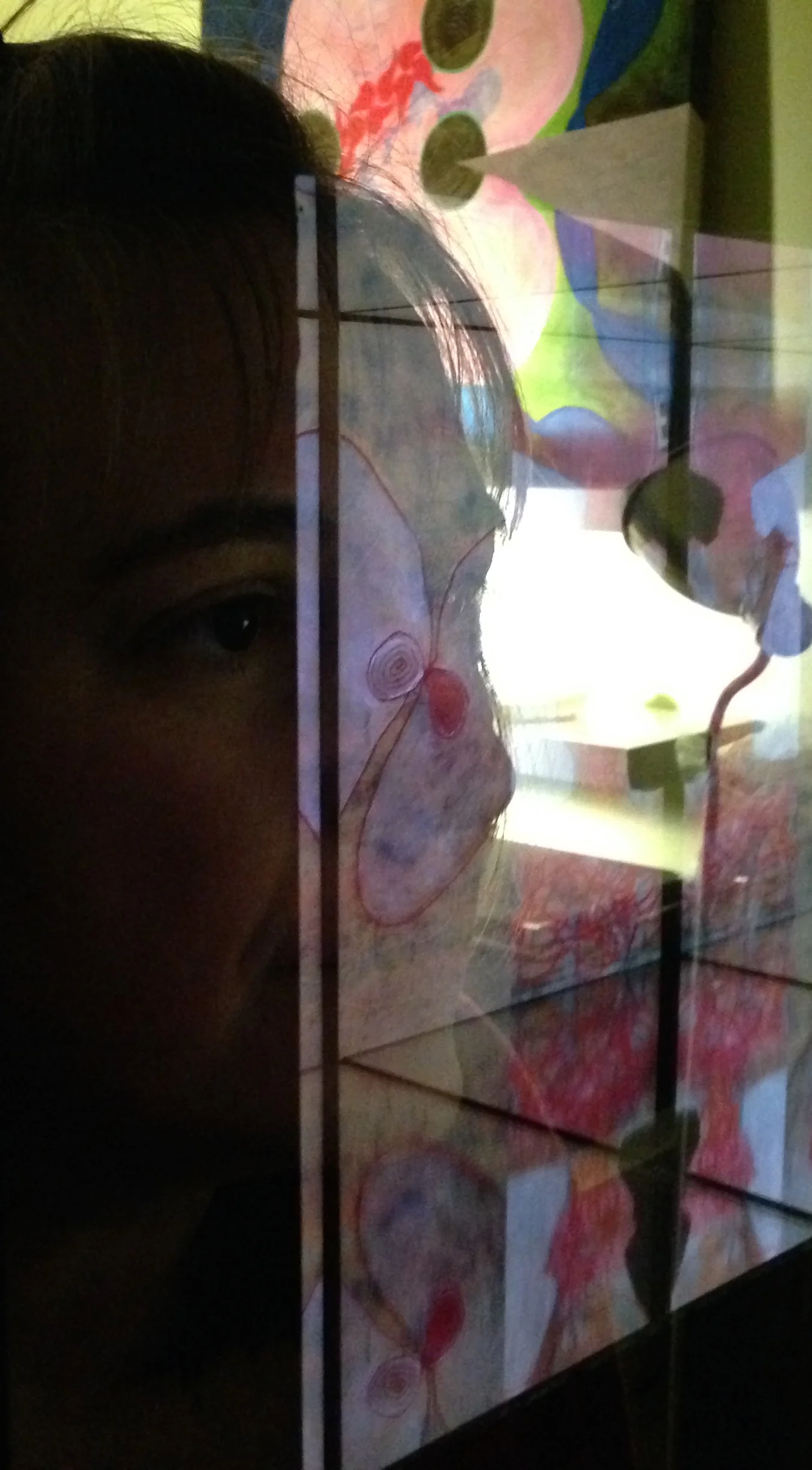  Here the&nbsp; Look In Glass &nbsp;box is hung on the wall next to the doorway. In the reflection one can see not only my face, but a lamp and a canvas on the shelf. I decided not to include the multitude of canvases, preserving instead a calmness t