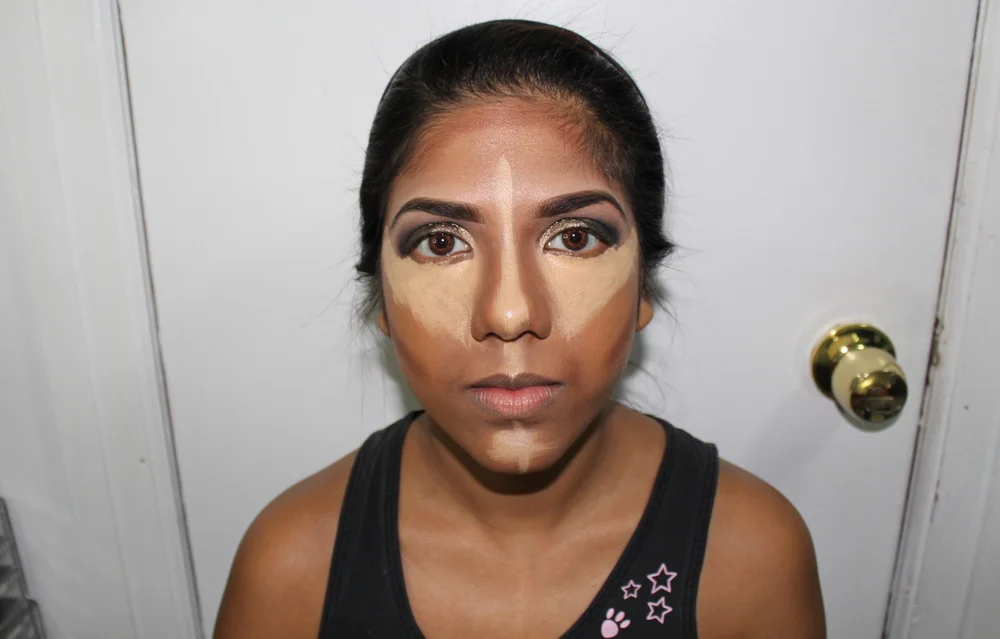 Contour is Key.  I used my favorite glam concealer by Kevyn Aucoin to create triangles under the eye. There's a number of ways to conceal under the eyes -- dots, stippling, triangles, buffing, etc.  I used the same concealer to create strokes on the
