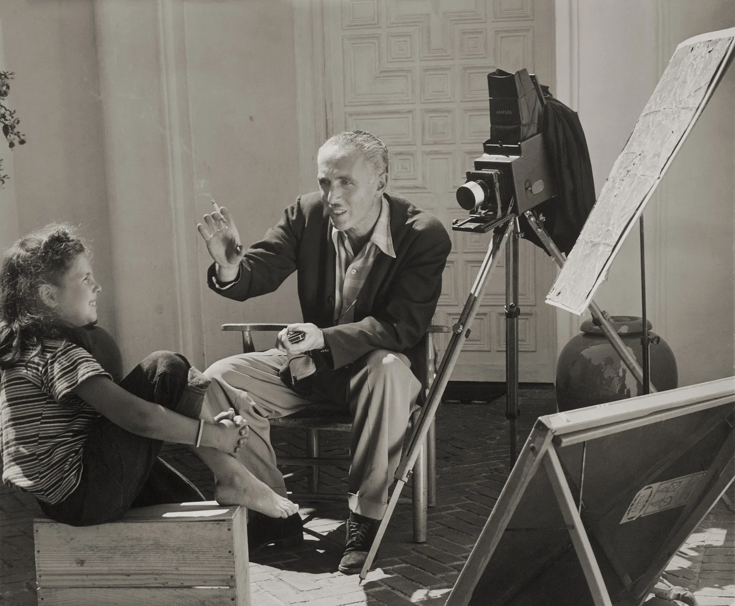 Irving Ellis posing daughter Judy in front of their Piedmont home