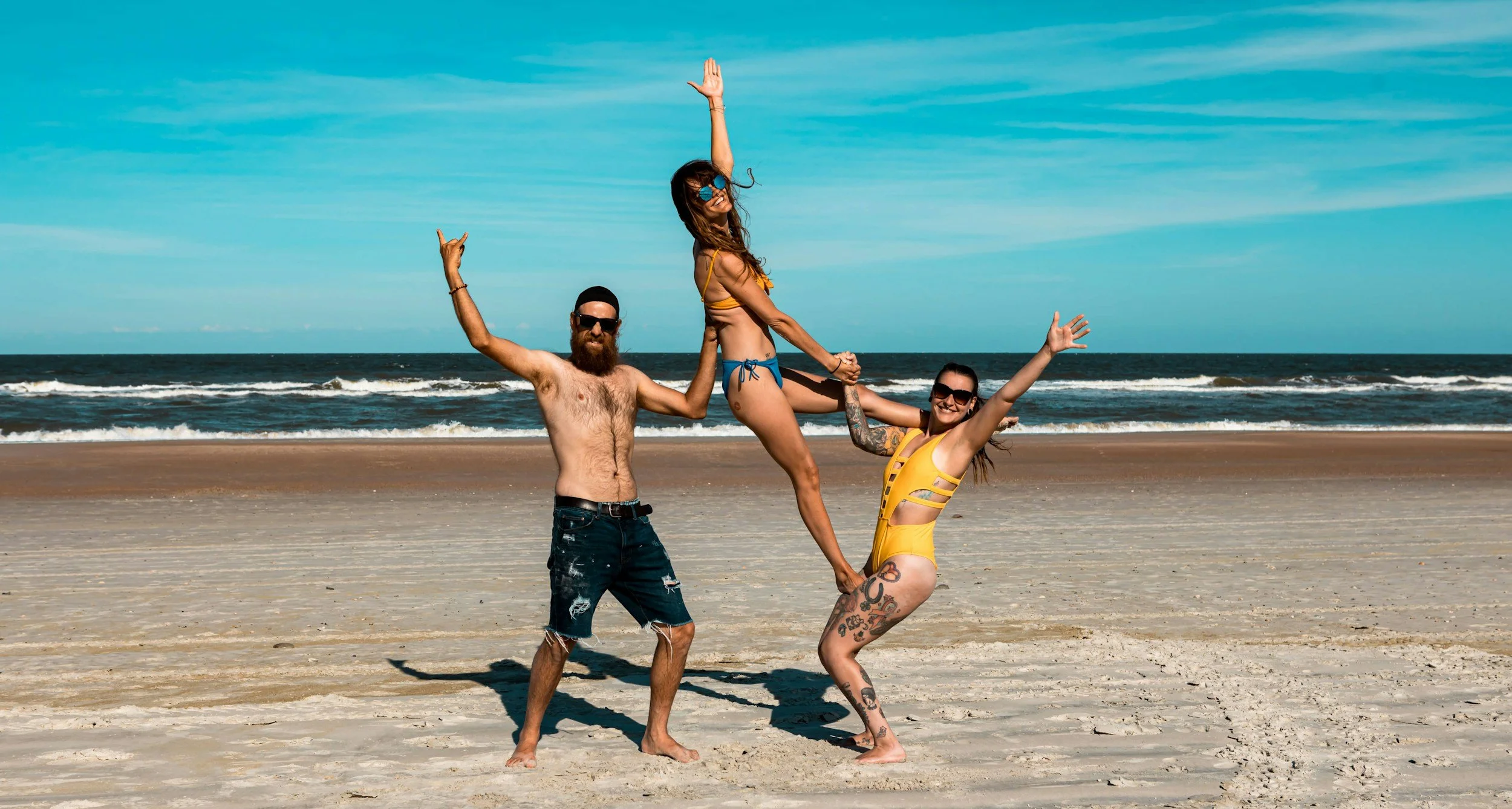 Three fiends on the beach