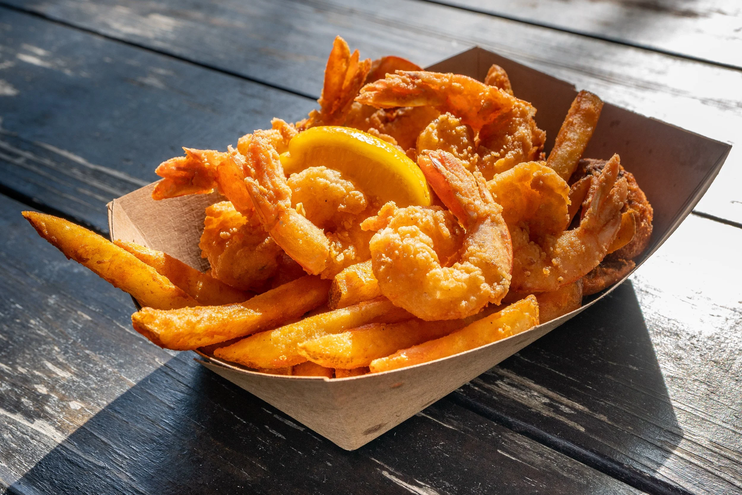 Timoti's Fried Shrimp Basket topped with a lemon
