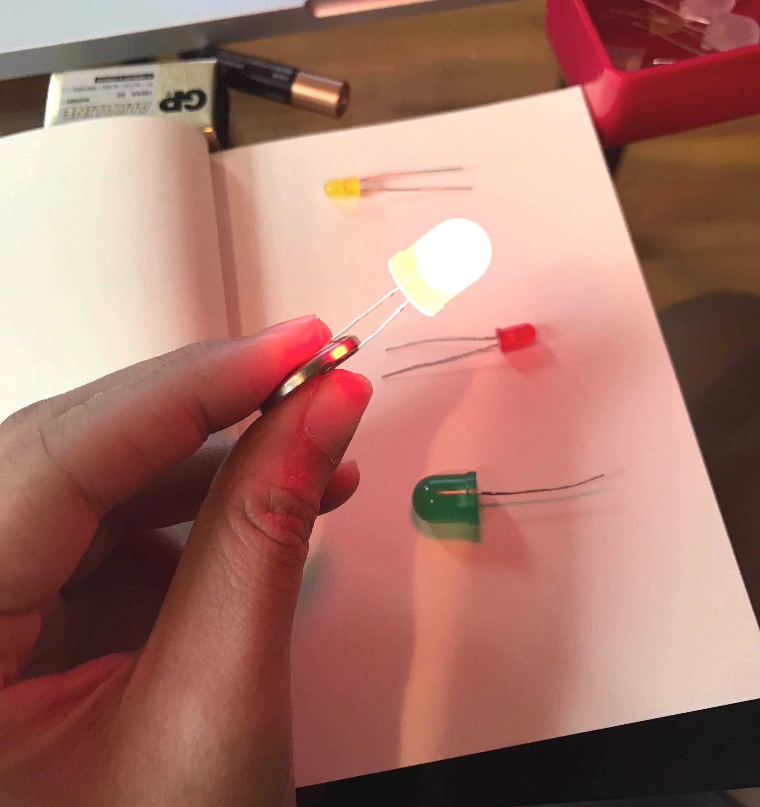 Checking LED light with the battery then assemble by attached it together with electrical tape