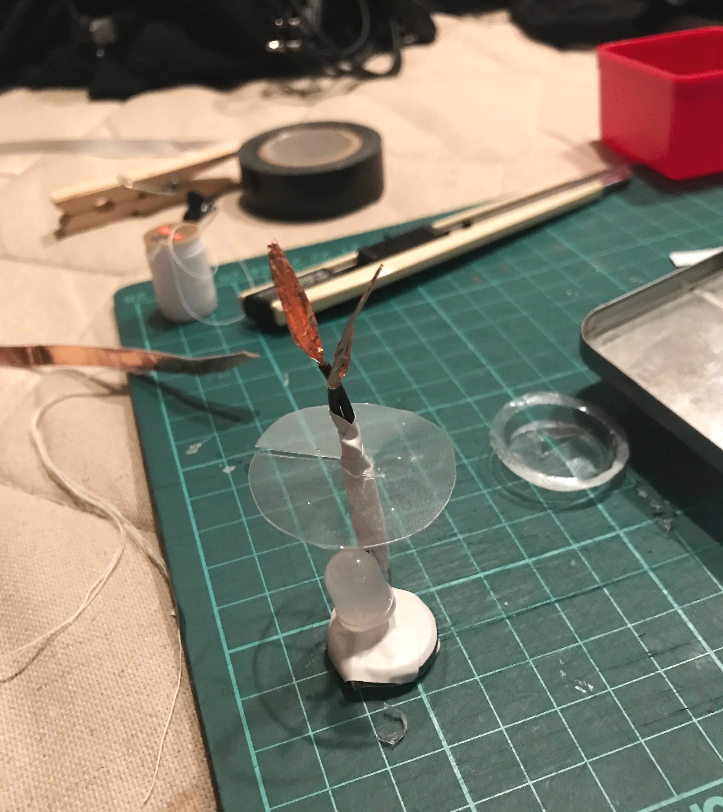 Core of the apple flashlight  - Think it would be nice if it’s able to hang as an actual apple, I also put a translucent plastic circle collar on it.