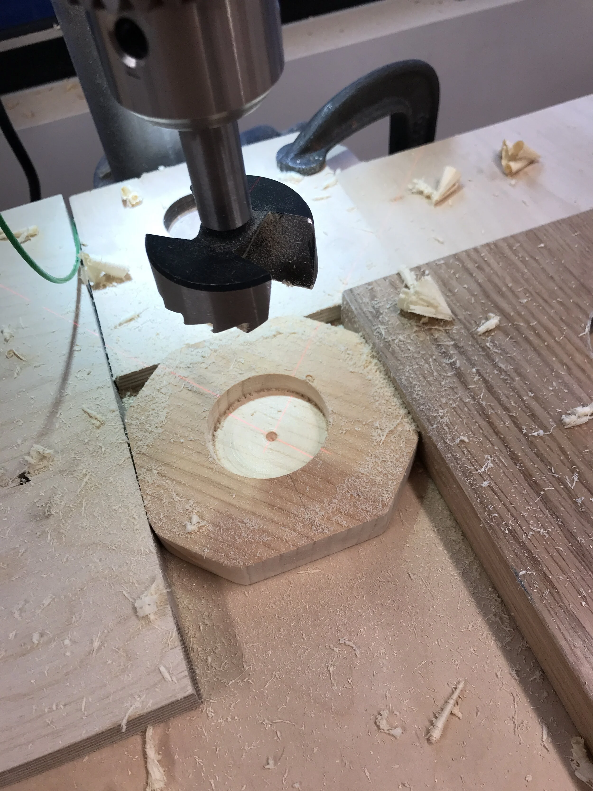 Use a stop blocks to drill the hole in the middle of the piece