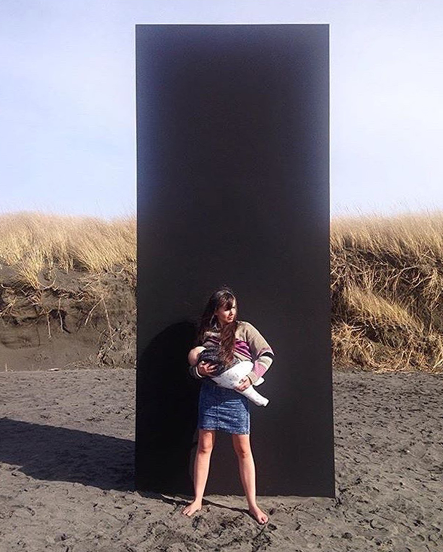 The intrepid Julia Barbee (co-founder of Spaceness ) and Iggy "Smalls" Suplee in front of the Monolith . In this photo, Julia wears the sweater designed by Ellen Lesperance for her Congratulations & Celebrations project.