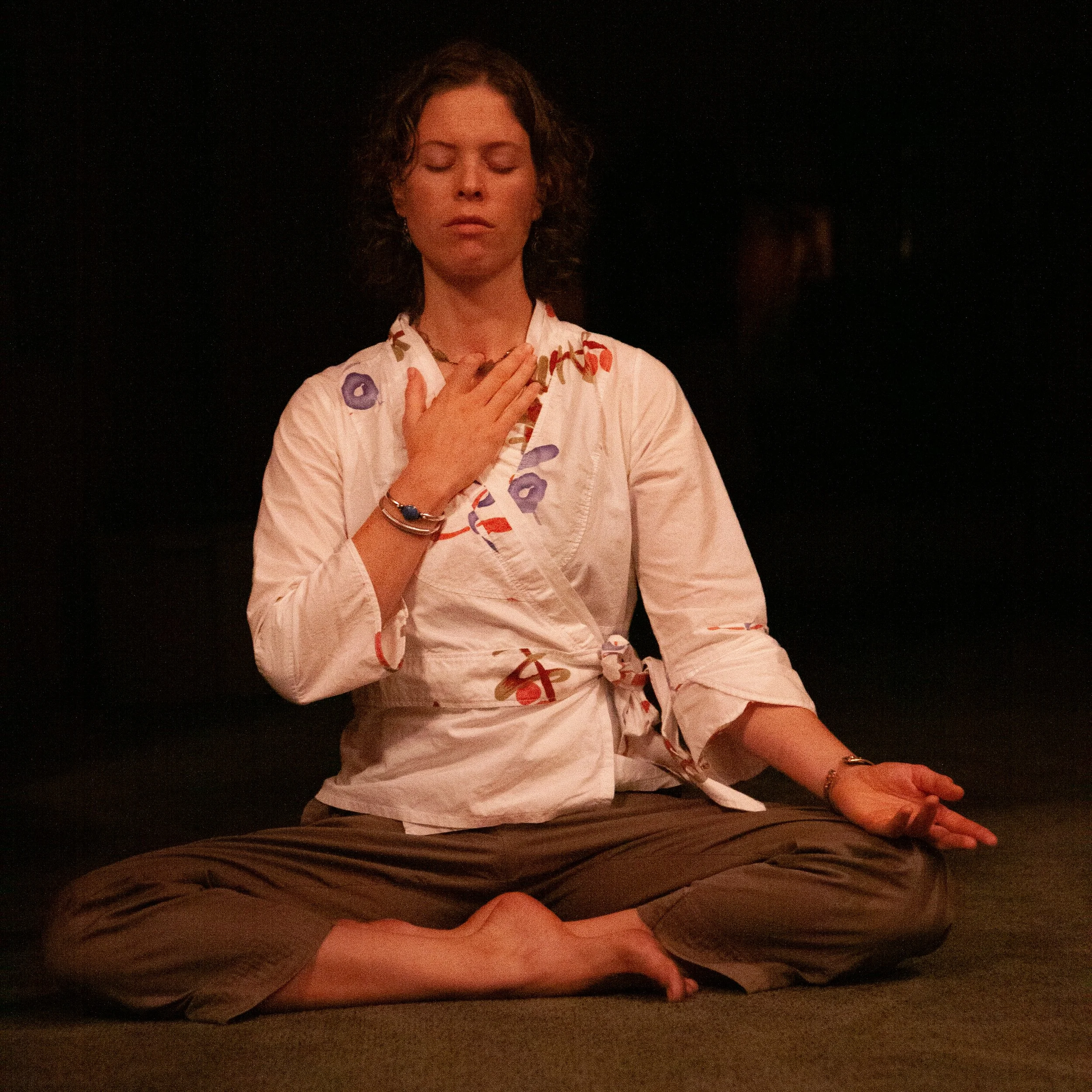 Priti sits absorbed in meditation