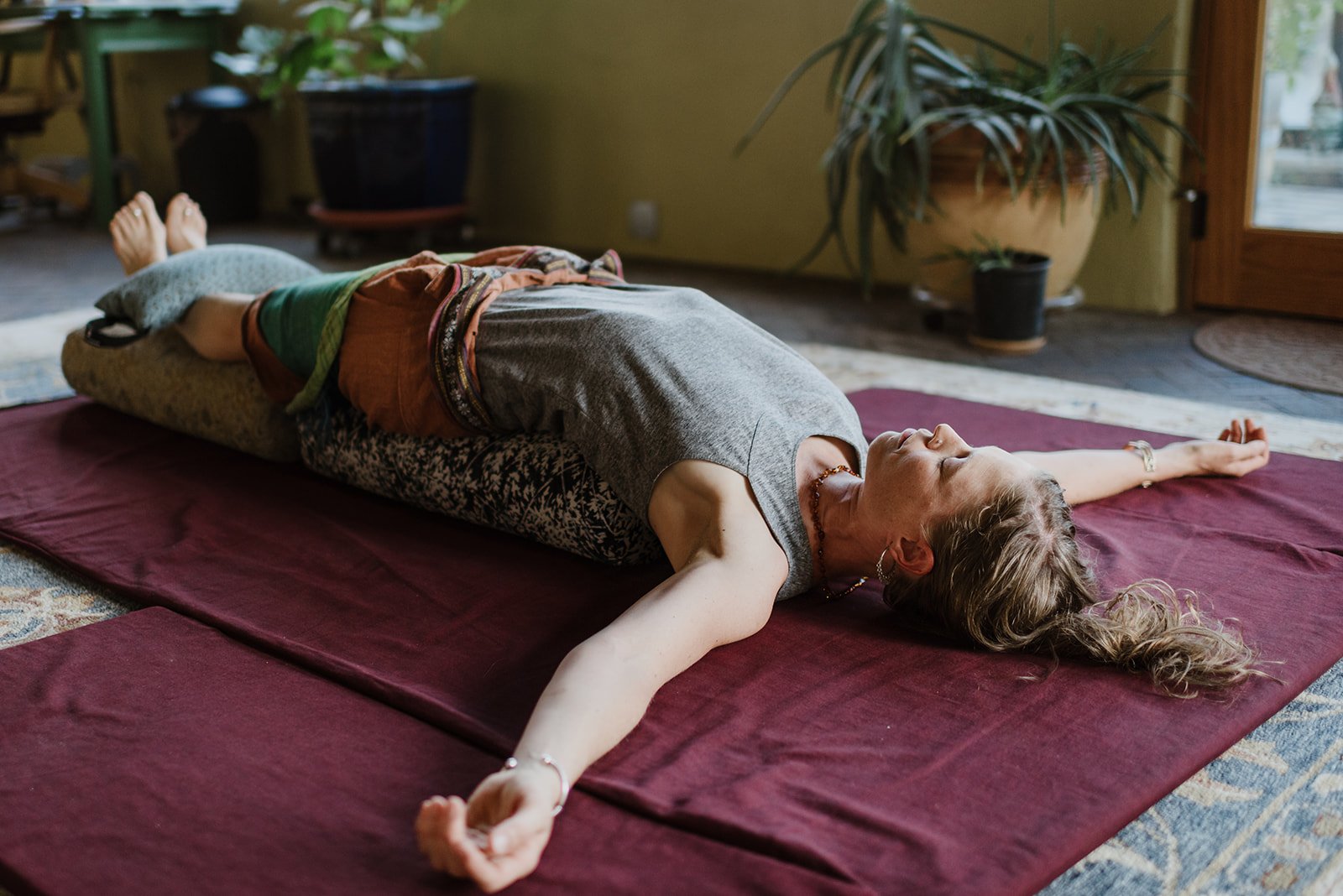 Chanda in restorative setu bandasana