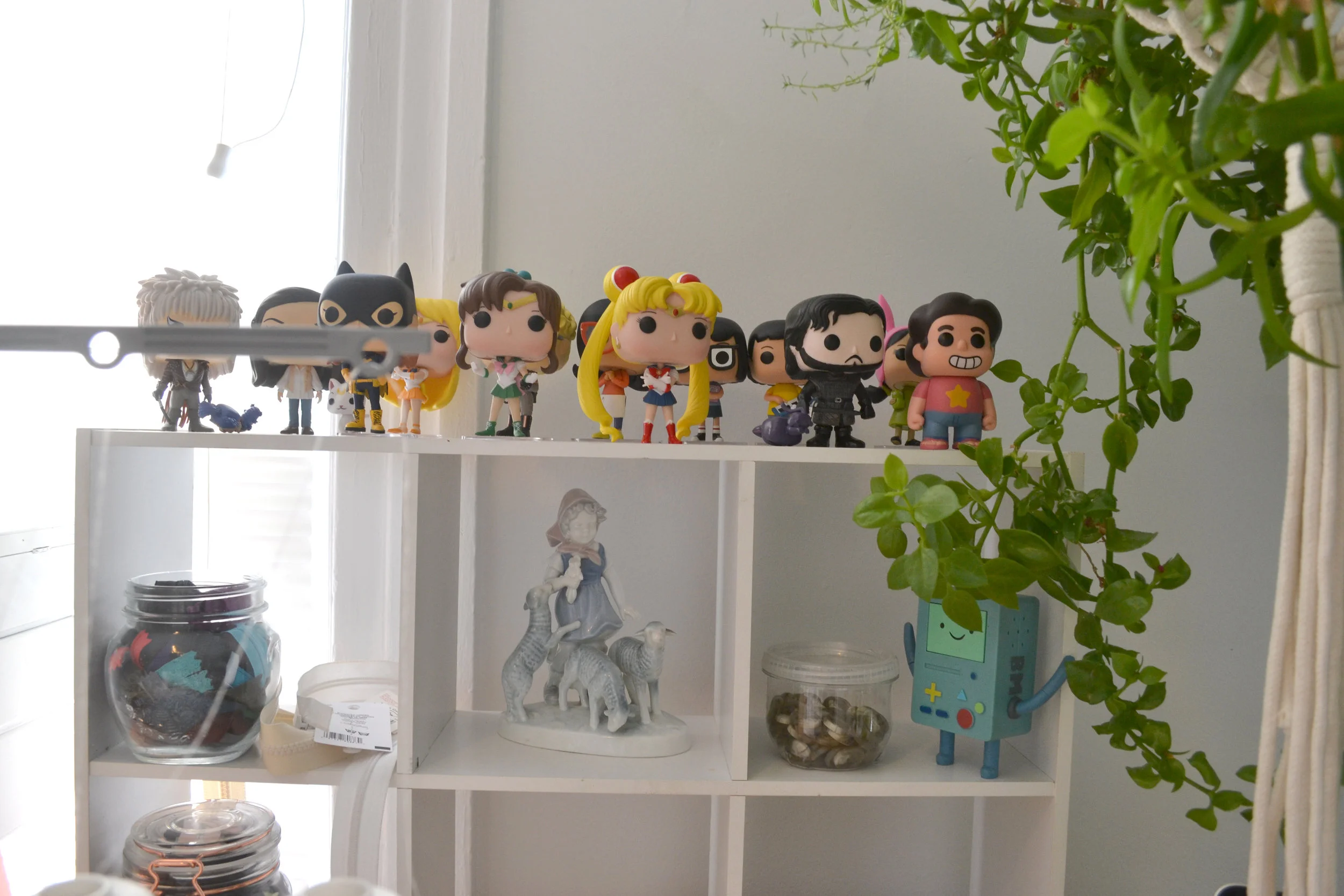 My Funko Pops keep falling off this shelf when I serge, so I'm going to have to find a new place to put them soon! I also collect weird lamb ceramics (to the dismay of my very utilitarian boyfriend)
