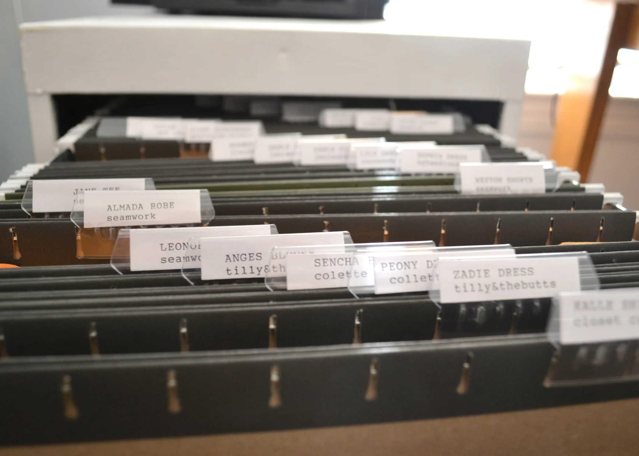 And finally we come to pattern storage. Still a work in progress, I keep my patterns in a filing cabinet I painted white and stack my printer on top of. I type out the labels on my typewriter because I'm twee AF, but it is becoming slightly tedious.