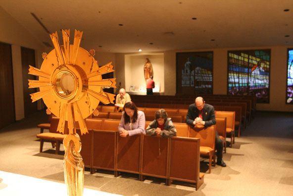 people praying at adoration.jpg