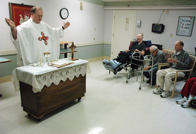 priest celebrating mass at nursing home.jpg
