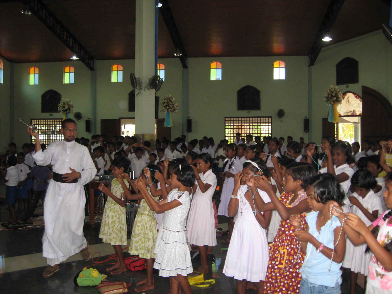 children in church with rosary.jpg