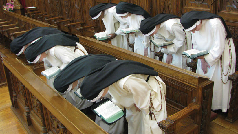 nuns with rosary bowing.jpg