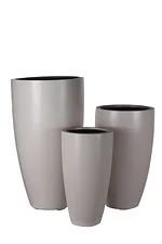 example of a tall crucible grc planter in a light grey painted finish