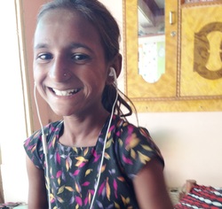  Usha listening to music on my IPhone