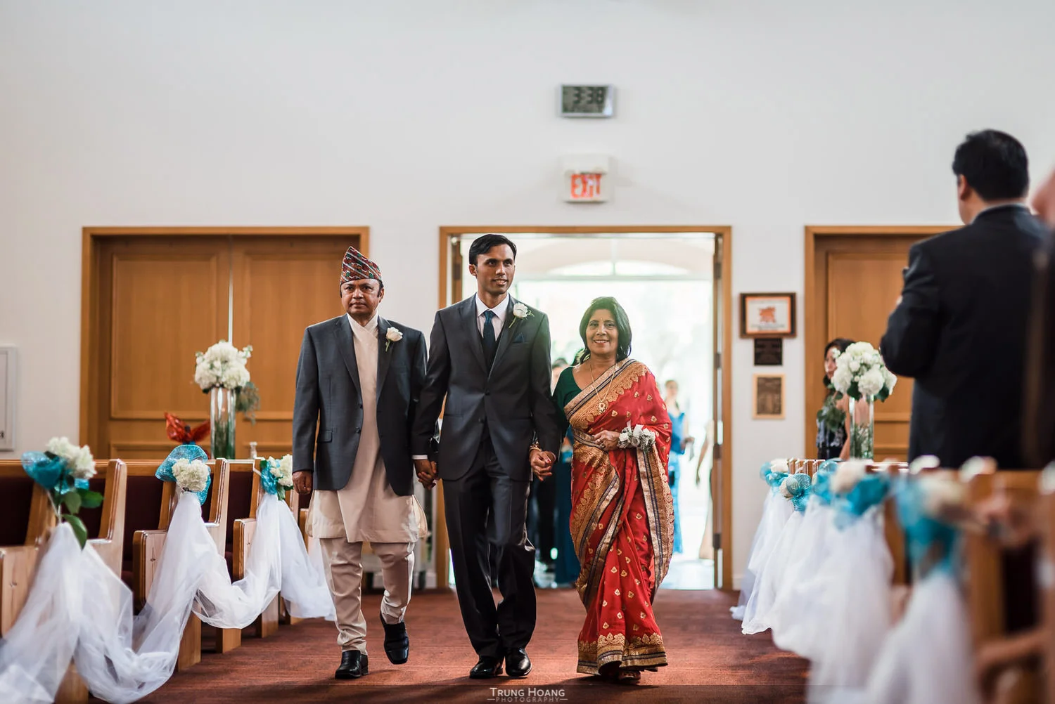 13-groom-walking-down-aisle-with-parents.jpg