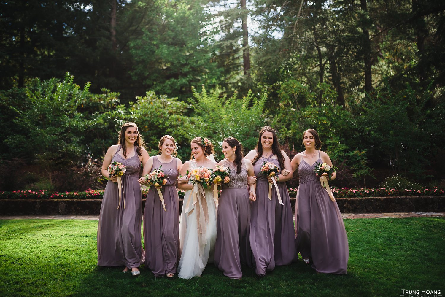 Bridesmaids linking arms photo