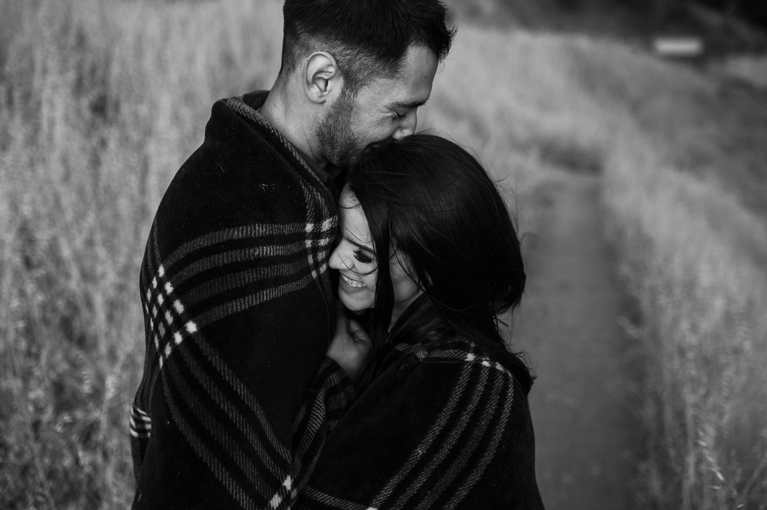 067_couple-together-under-blanket.jpg