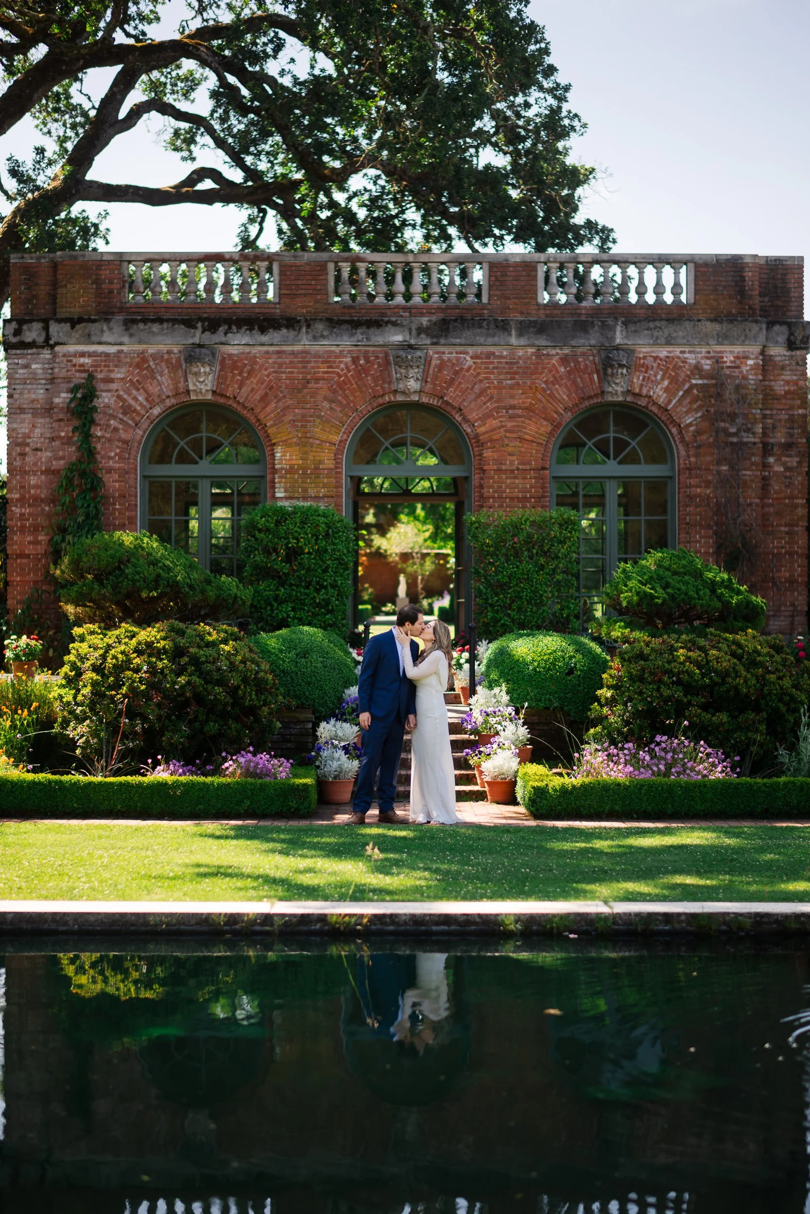A couple kisses in the Sunken Garden at Filoli in Woodside, CA