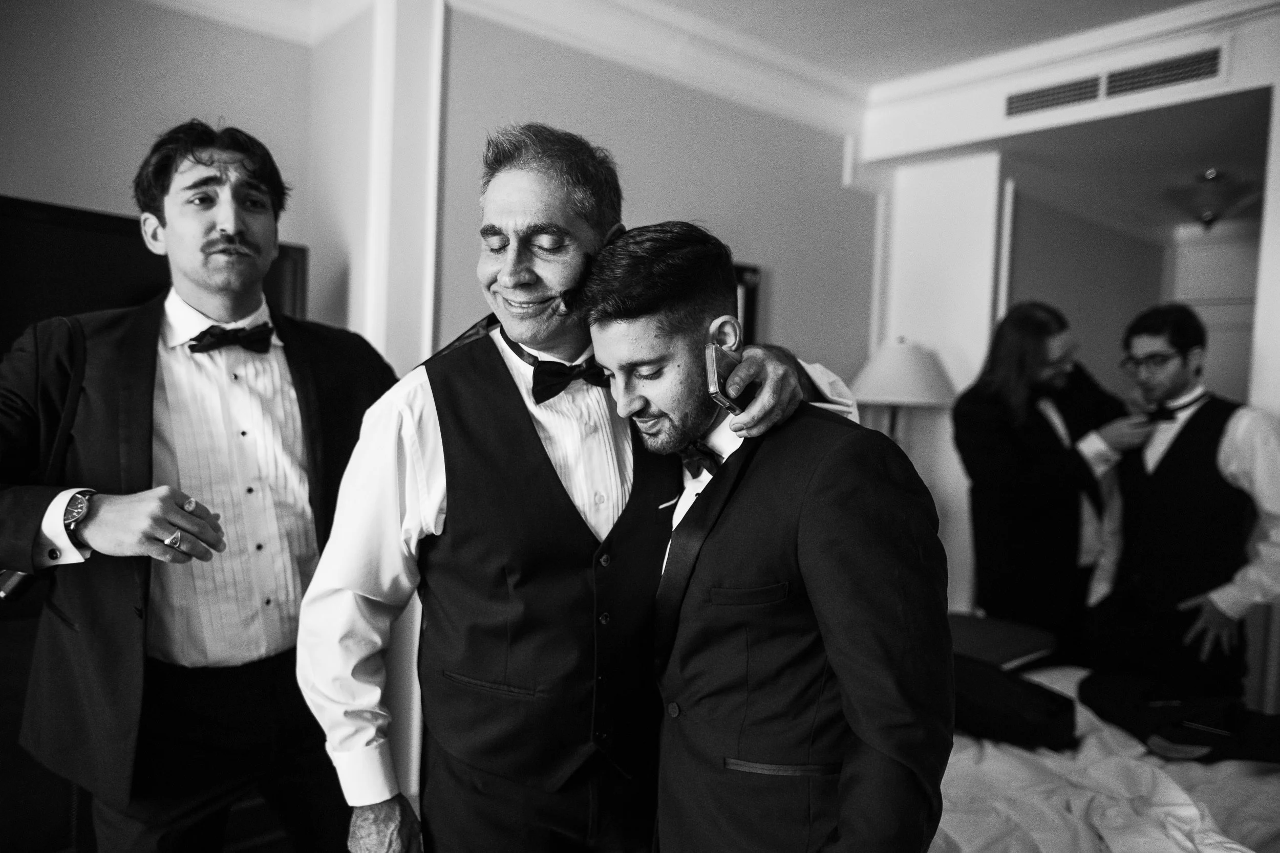Father and son share a warm moment ahead of a wedding at the Intercontinental Mark Hopkins