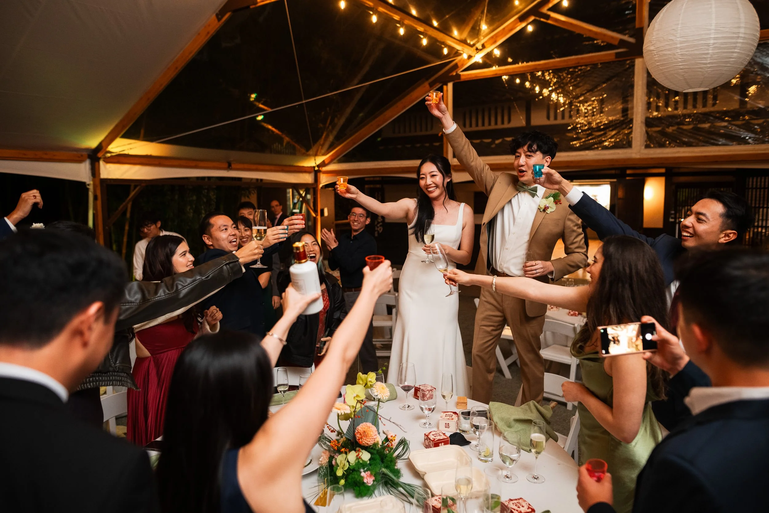Guests celebrate the bride and groom during a table visit