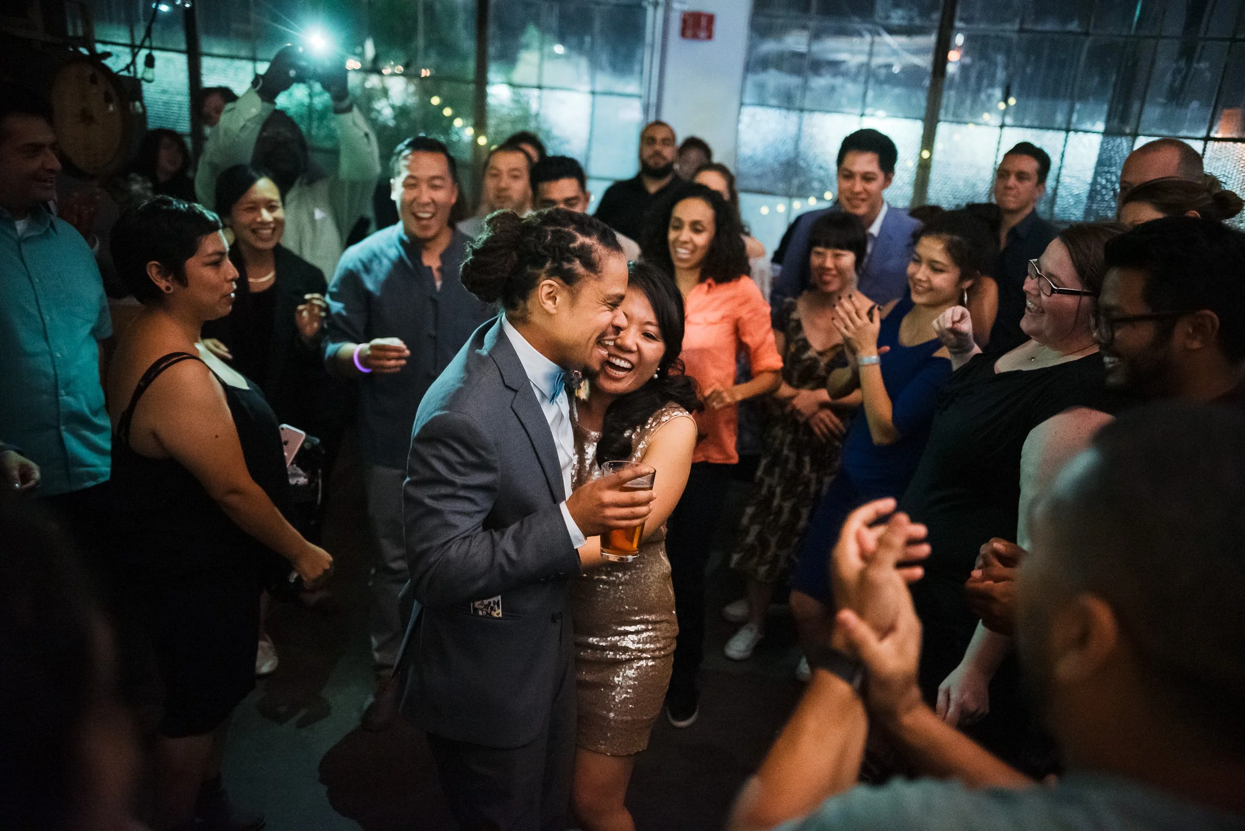 Couple having fun on the dance floor of their after party
