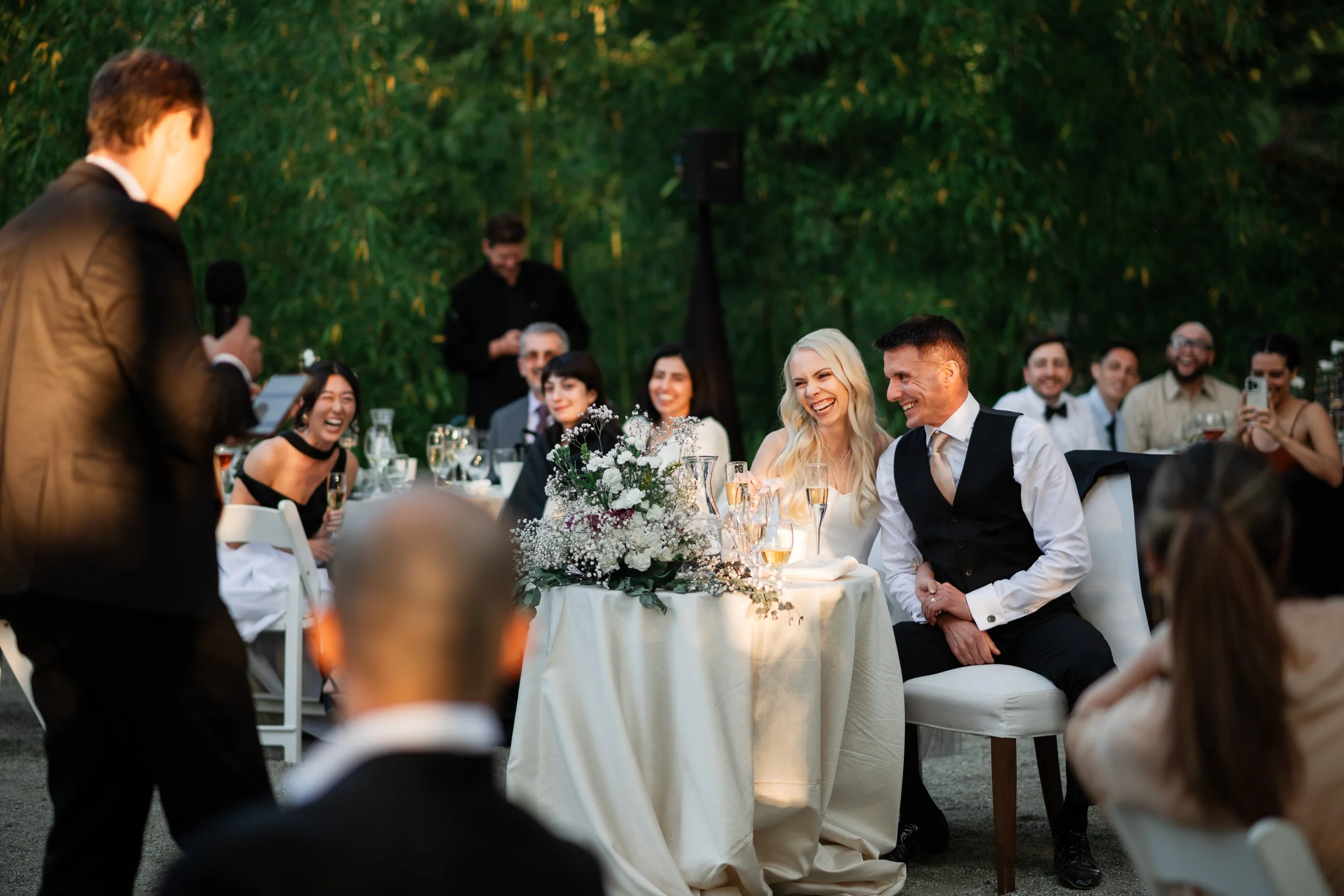 Couple laughing during toasts