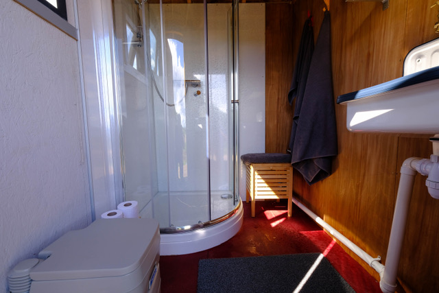 Bathroom with shower and compost toilet.