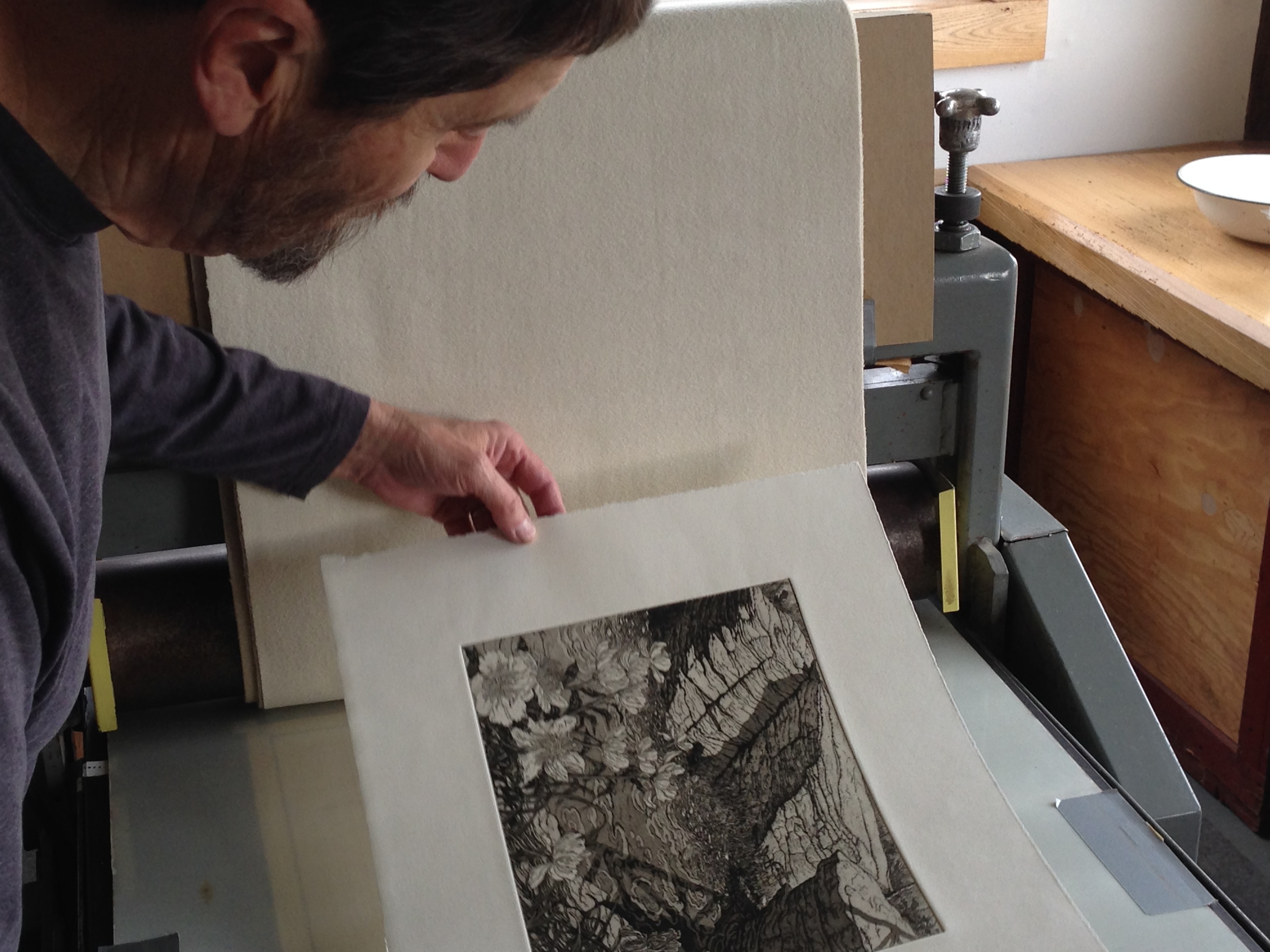 Roger Bailey examines one of the edition prints.