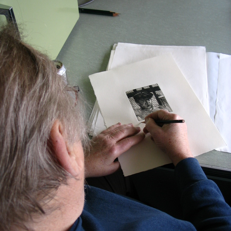 Jack Beal signs the edition of etchings, April 28, 2005.