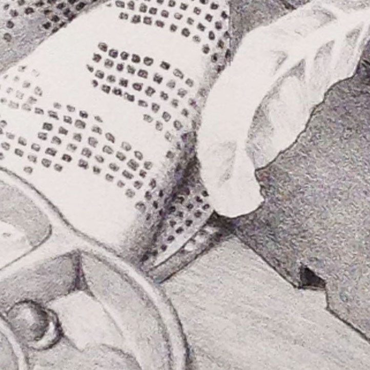 A porcelain palette, blobs of water color paint, a piece of fabric, a plastic pot and a wooden table top all meet in this detail.