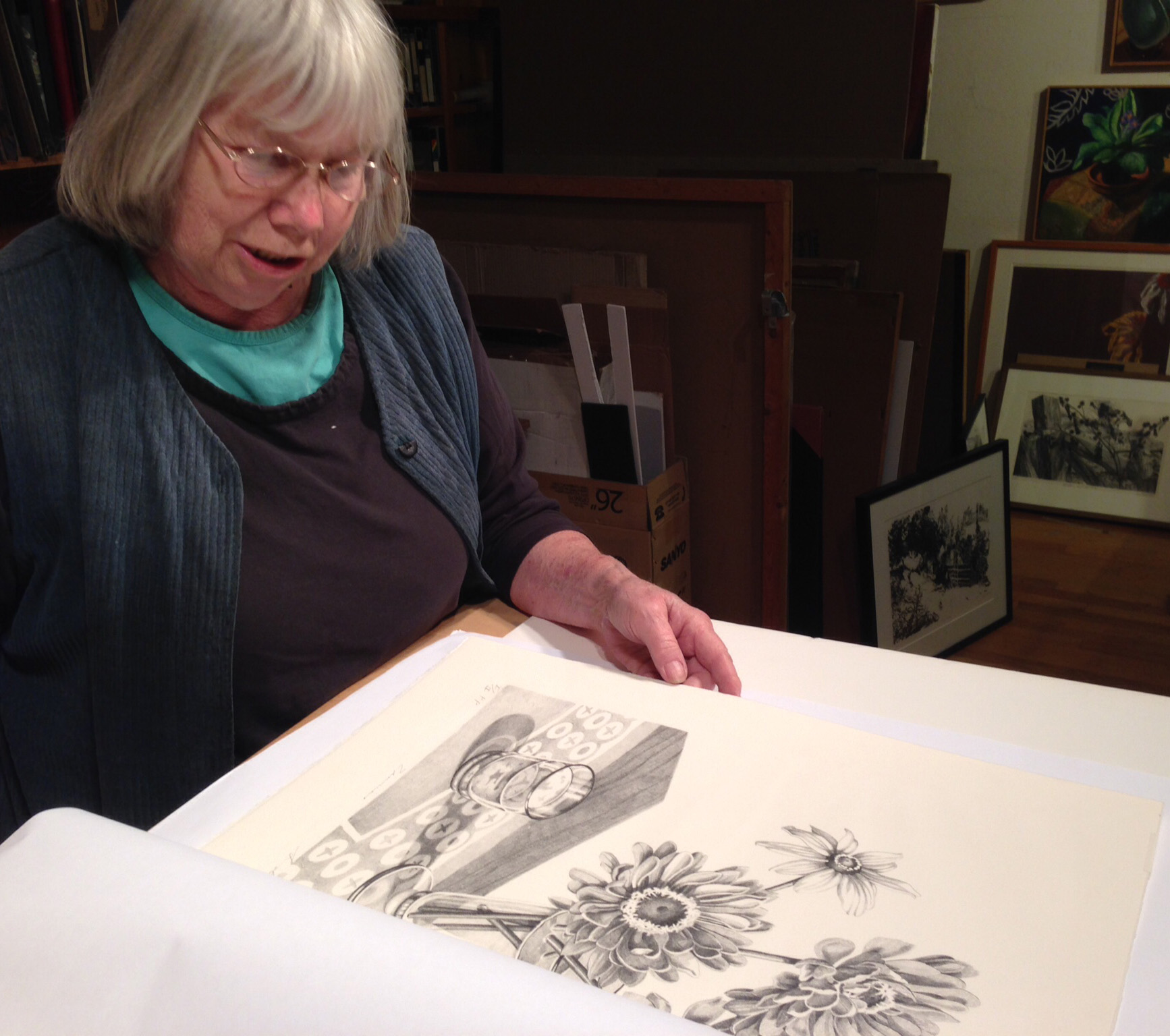 Sondra examines one of the prints from the edition.
