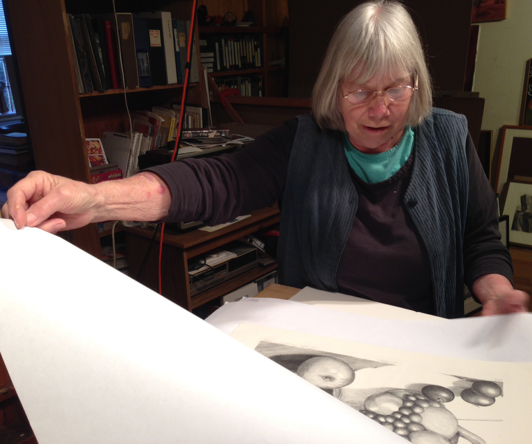 Sondra examines one of the prints from the edition.