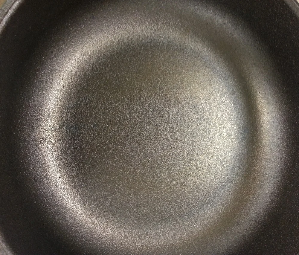 A closer look at the AUSfonte sanded cooking surface. Note: don't worry if you see small pin holes - they do not affect cooking or hygiene. This is real cast iron, not pressed smooth iron sheet or enamel-coated cast iron (which fills the normal pinholes in other brands), and it's not Teflon coated. It's pure natural, non-toxic, hand-smoothed cast iron with personality. Embrace it.