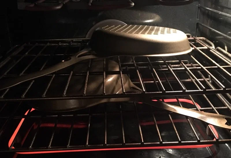 Place skillet/s upside down in oven for 1.5 hours.