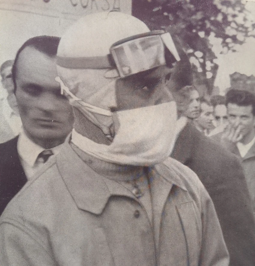 NUVOLARI, THE MAN EVERYONE WAS CONVINCED WOULD DIE IN A FIERY WRECK. BUT HE WAS TOO GOOD FOR THAT: HERE HE IS WITH THE SURGICAL MASK THAT FEATURED IN MOST OF HIS POST-WAR RACES…