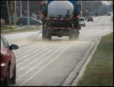 A truck applies salt brine to a road prior to a storm, a practice that can reduce the amount of salt used to keep roads open. (photo courtesy of the Village of Hanover Park)