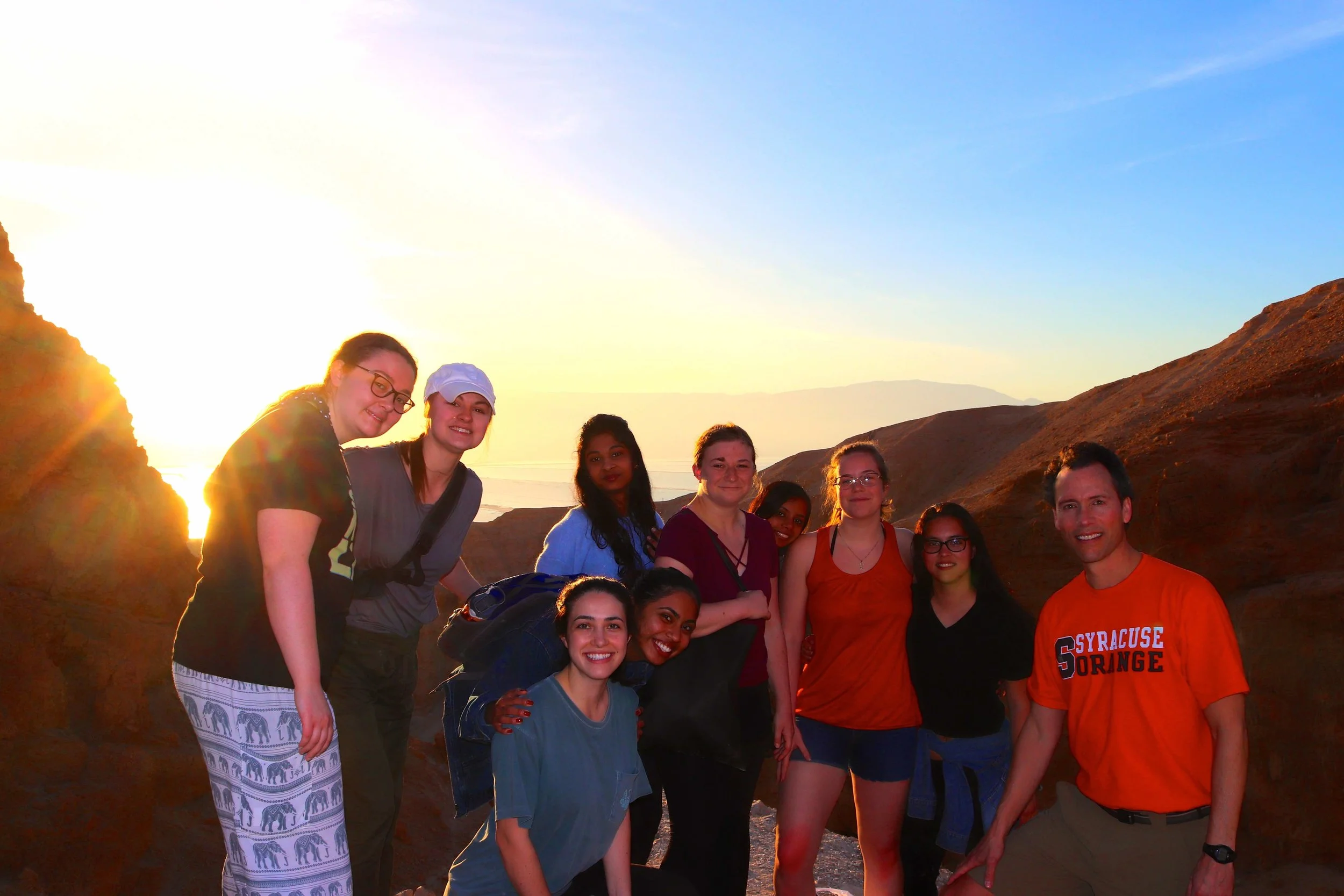 Newhouse students at sunrise overlooking the Dead Sea.