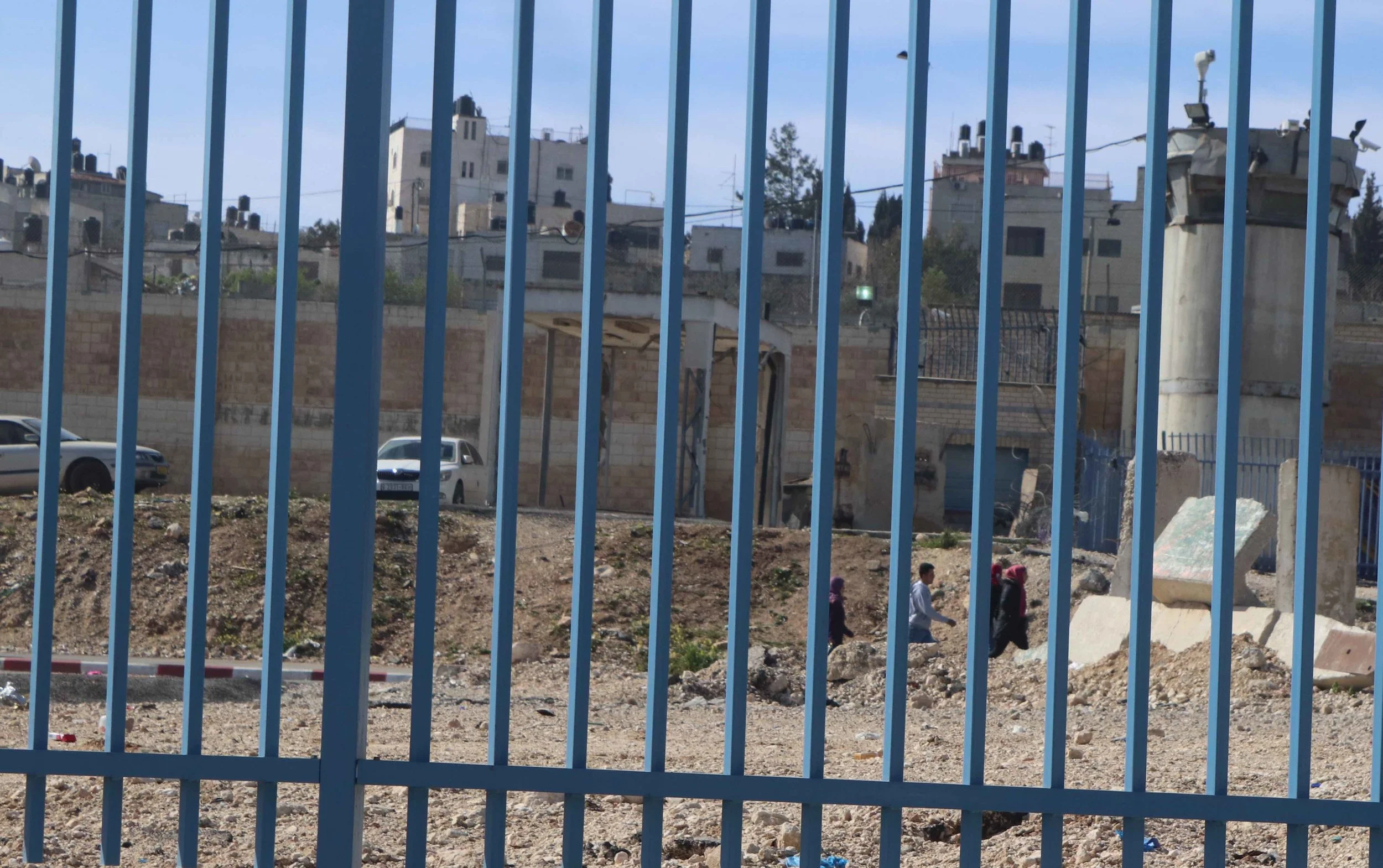 … and along paths lined with fences and barbed wire.