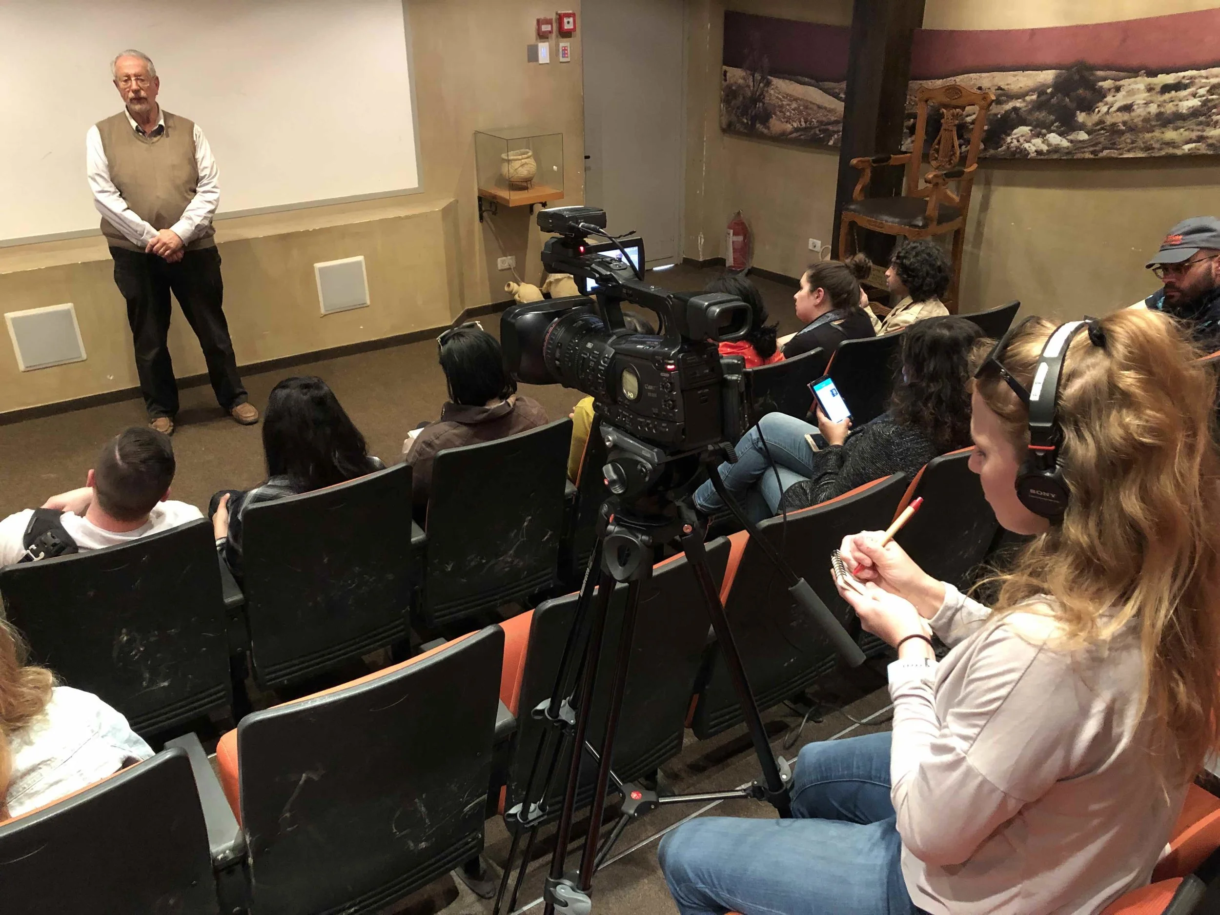 Newhouse students reporting during a talk by Yisrael Medad.