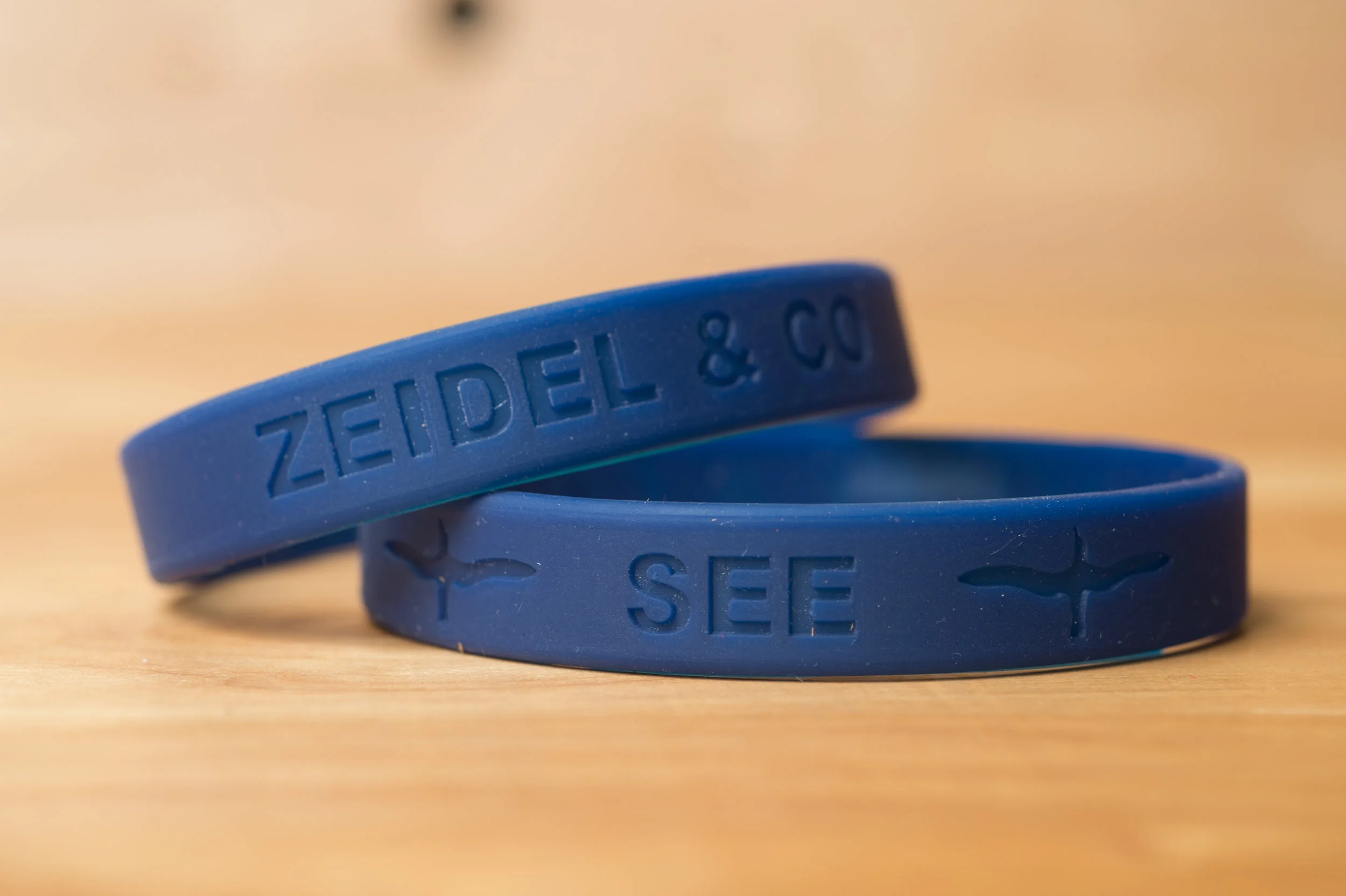 The SEE Alby rubber wristband is the perfect way to showcase your support. $5