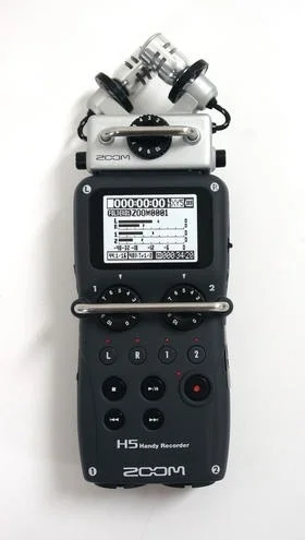 My primary audio recording device is the Zoom H5, rigged up nicely for interviews, voice-over, attached to a boom pole, or for recording sound effects for use in films. 