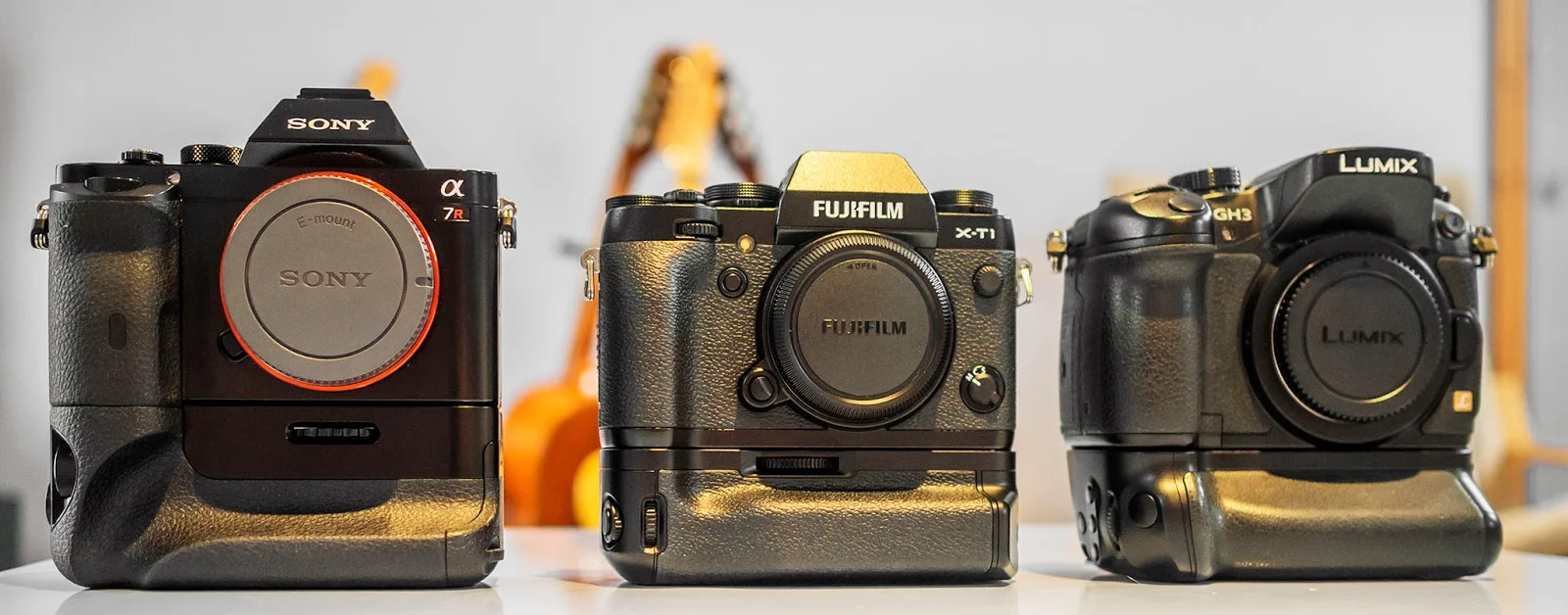 Fuji X-T1, Panasonic GH3, Sony A7r all with battery grips.