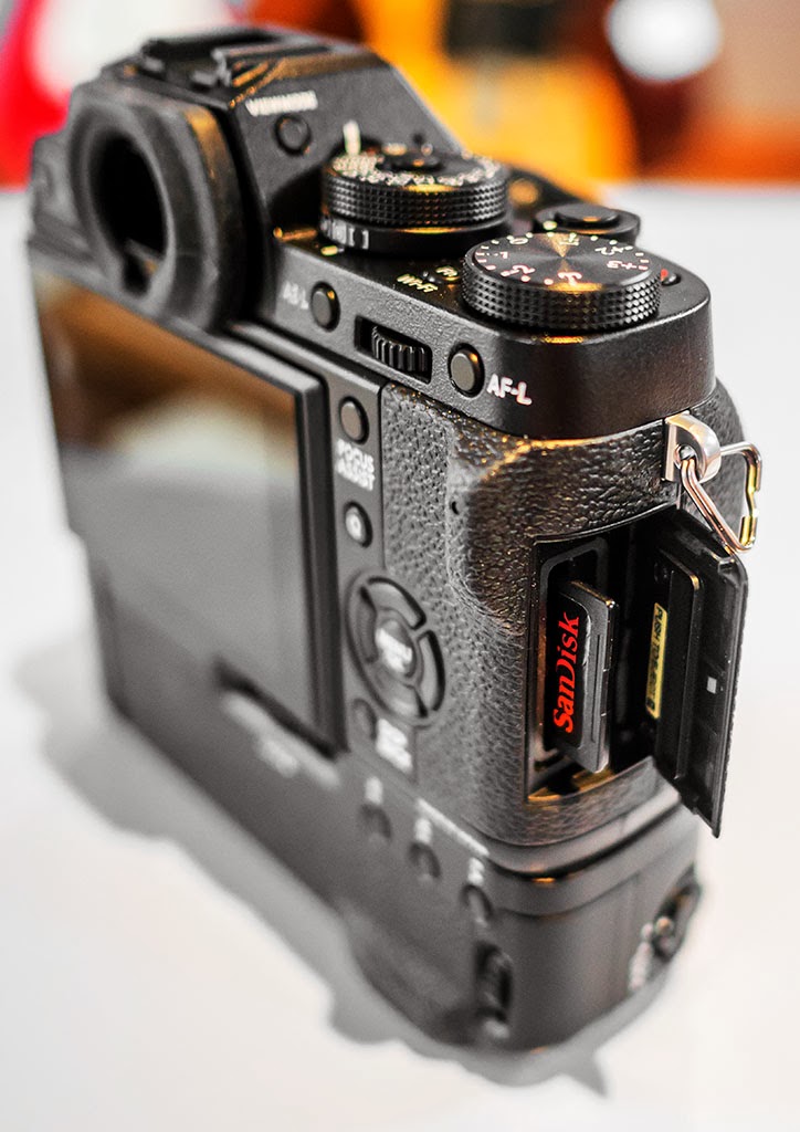 Fuji X-T1 showing SD card compartment.