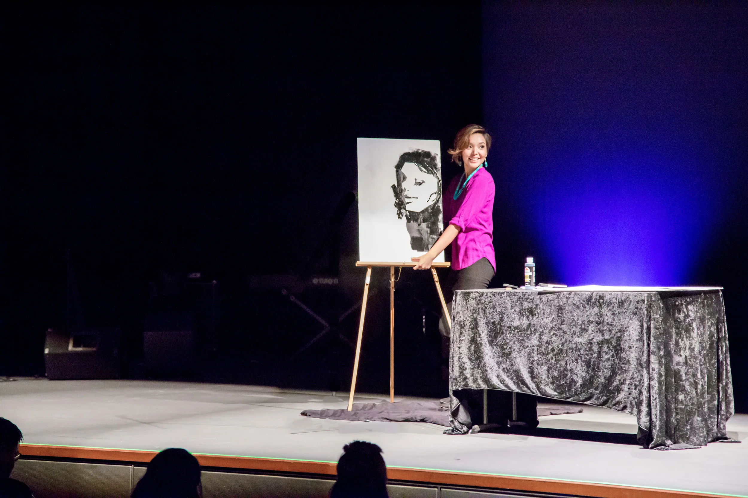 Contestant Ashley Bitselley showcasing her talent of creating this beautiful painting upside down!