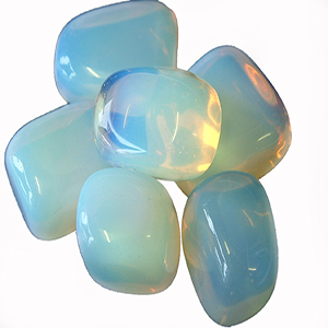 OPALITE: Milky white or translucent in color, opalite is known as the “Stone of Eternity”, reminding us we are not limited to our physical selves, but that our souls are eternal. It is a very harmonizing stone and assists during times of transition of any kind. It balances out negative or hostile environments for the betterement of all involved. Opalite improves communication within relationships and on a spiritual level and gives us the courage to speak our minds to promote truth without fear. It also aids in sexual prowess and transforms any negative sexual experiences or events of the past. In matters of health, opalite purifies the kidneys and blood in order to increase levels of vitality in times of extreme fatigue or energy-loss. We are obsessed with the color-play that occurs when the sunshine hits opalite and it seems almost as if the stone itself is radiating an aura about it. 