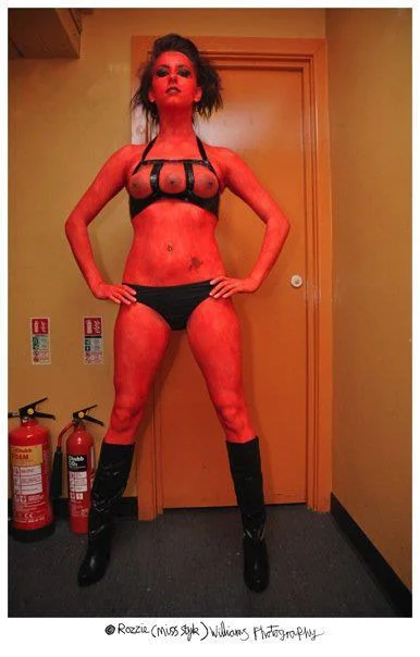 Triple-breasted alien at 'The Pit of Curiosities II' event