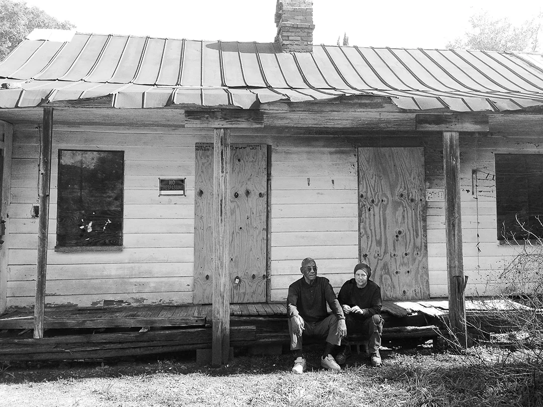 Mr. Ravenel, talking about the history of his Charleston, outside of a Freedman's Cottage.