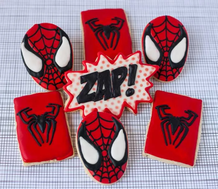 Spiderman comes flying in.